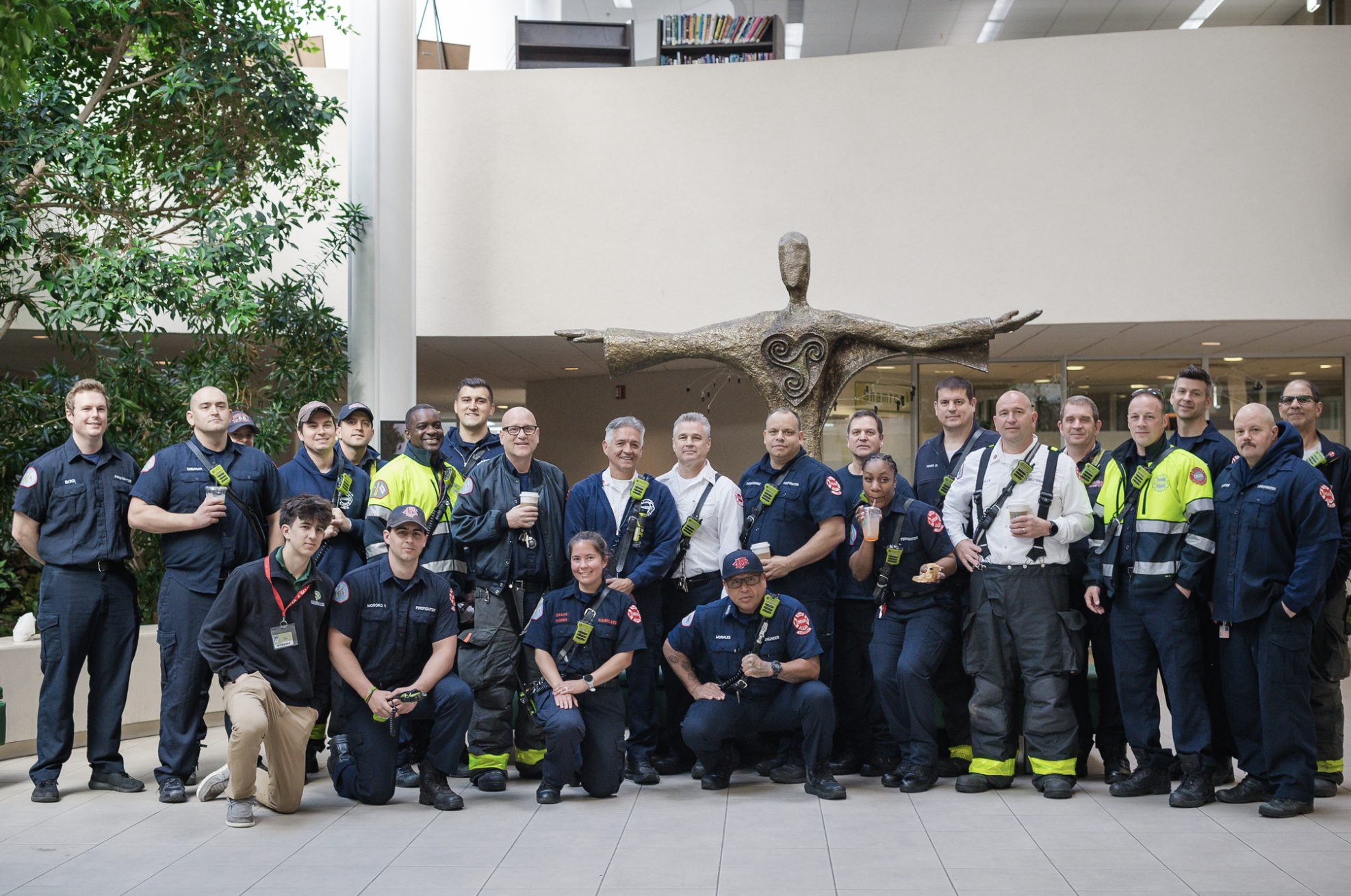 The Brother Joe's crew with Chicago Fire Department members in the school atrium